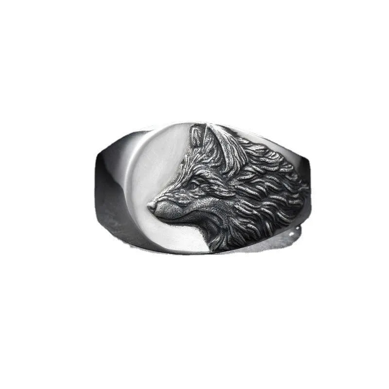 Men's geometric wolf head alloy ring in silver colour on a size guide showing UK sizes 6 to 12.