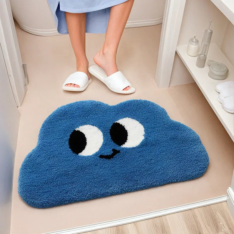 Cartoon anime clouds design bath mat in green, blue, pink, black, or white, available in three sizes.