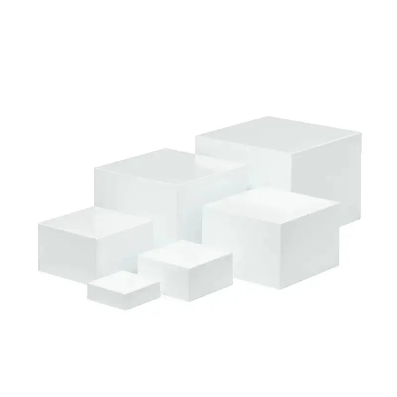 White plastic dessert display stand with six stacking cubes for tiered cake and dessert presentation