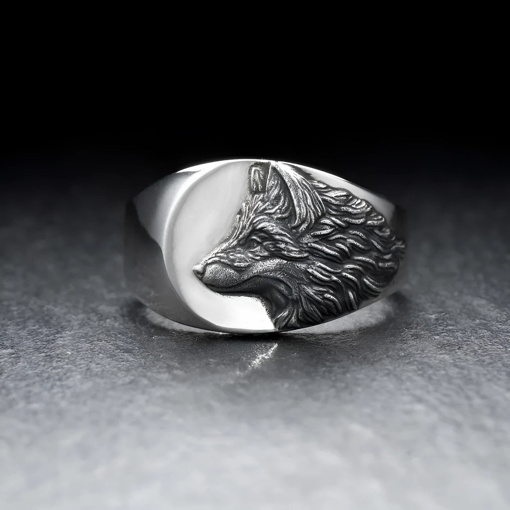 Men's geometric wolf head alloy ring in silver colour on a size guide showing UK sizes 6 to 12.