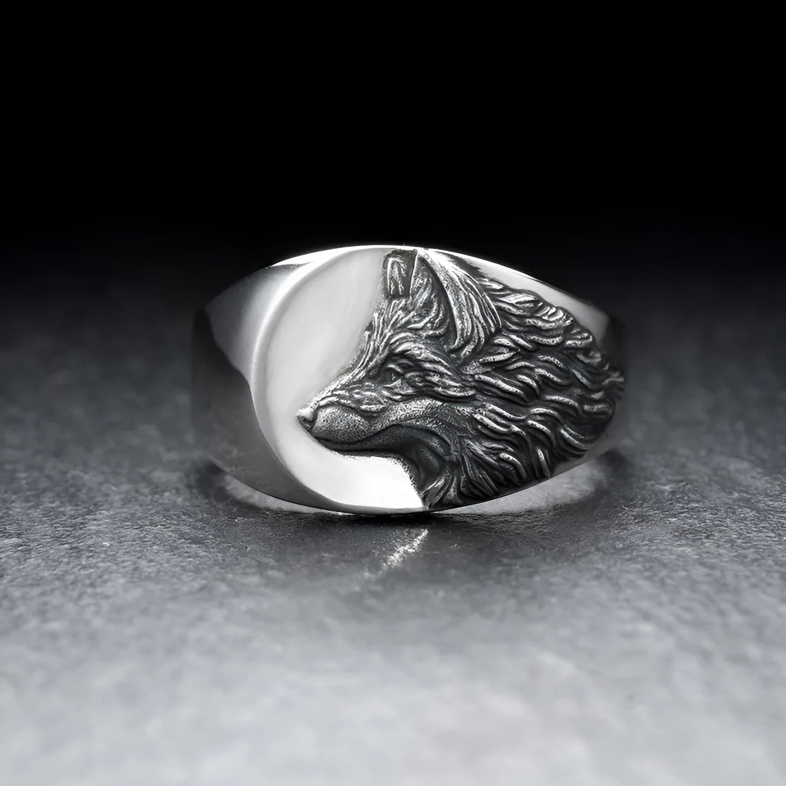 Men's geometric wolf head alloy ring in silver colour on a size guide showing UK sizes 6 to 12.