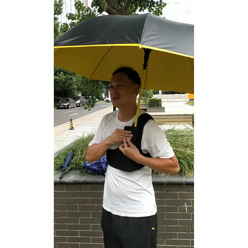 Black portable umbrella holder with shoulder strap for hands-free use with a manual umbrella.