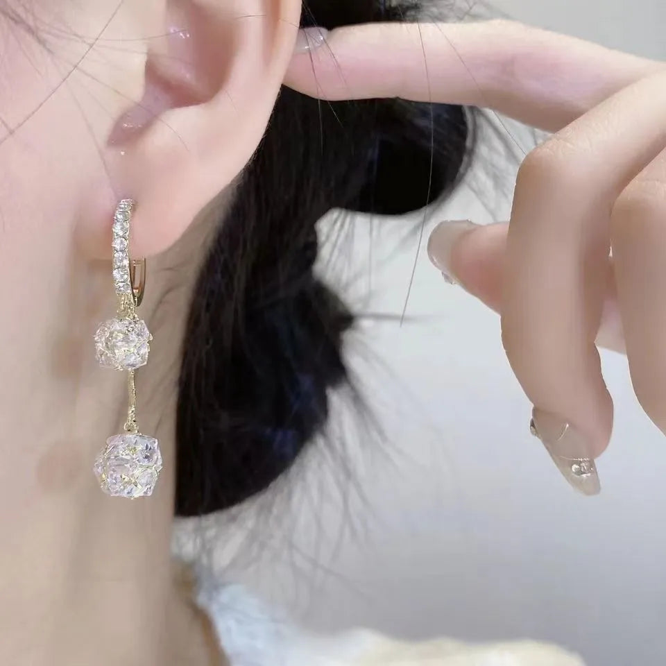 Silver tassel ball earrings with confession balloon pendant and rhinestone details on ear clips