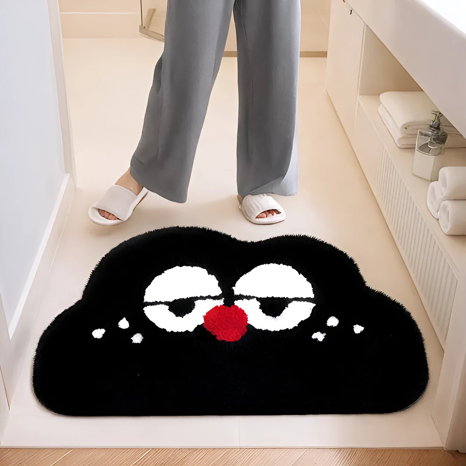 Cartoon anime clouds design bath mat in green, blue, pink, black, or white, available in three sizes.