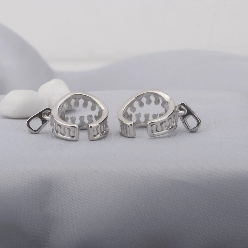 Copper geometric ear clip with zipper design detail and simple line elements