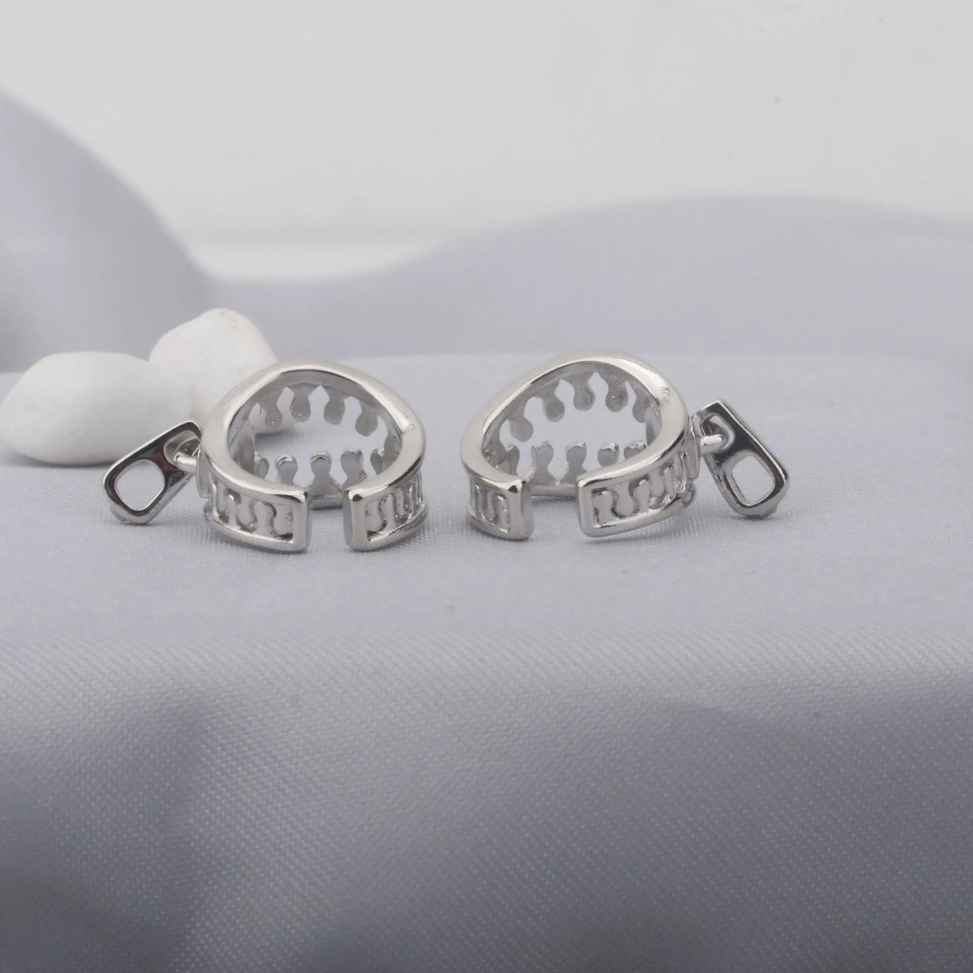 Copper geometric ear clip with zipper design detail and simple line elements