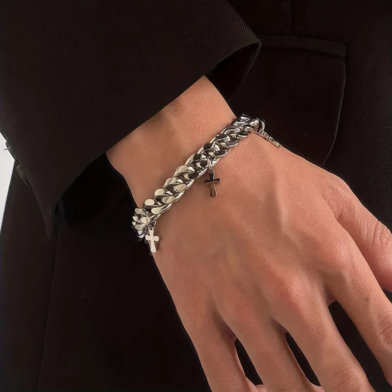 Men's titanium steel bracelet with a geometric shape and cross design on a wrist.