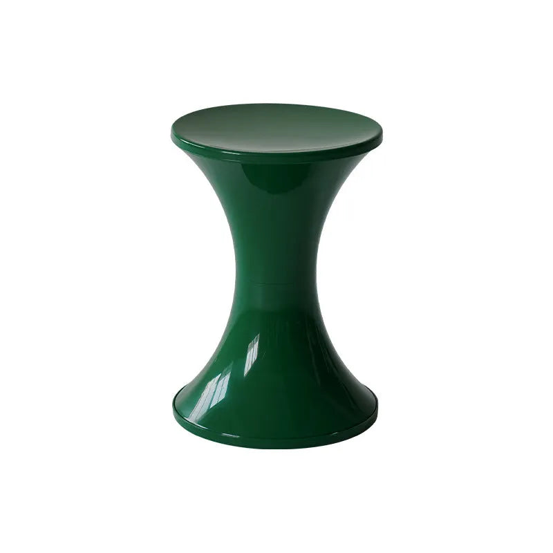 Hourglass-shaped plastic shoe changing stool in green, shown as a step aid.