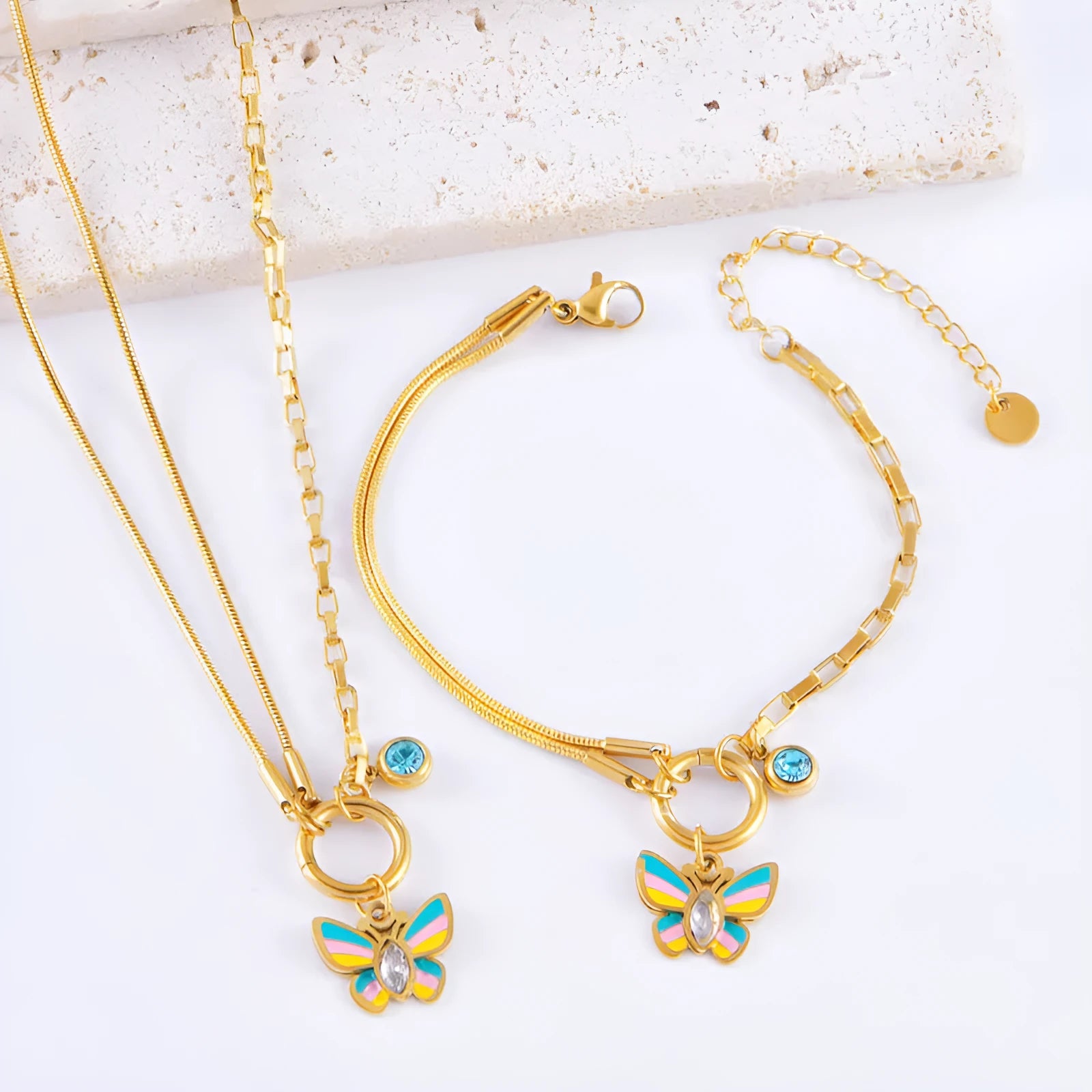 Gold titanium steel jewellery set with colourful epoxy butterfly pendant designs