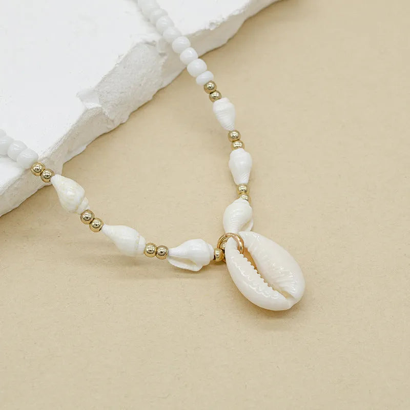 White electroplated conch shell bead necklace with mother pearl shellfish pendant