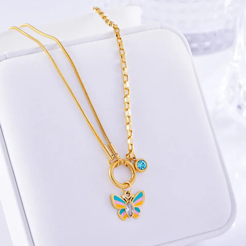 Gold titanium steel jewellery set with colourful epoxy butterfly pendant designs