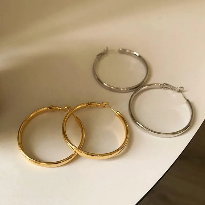 Gold and silver metal circle hoop earrings with 40mm diameter electroplated copper construction