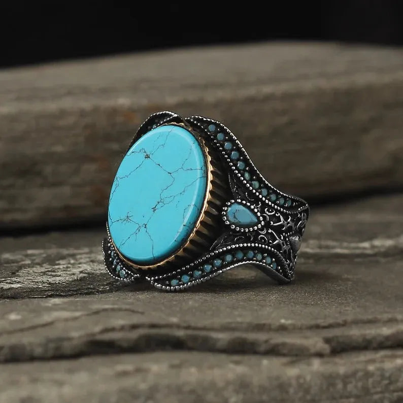 Men's antique silver turquoise alloy ring showing round simple design on finger