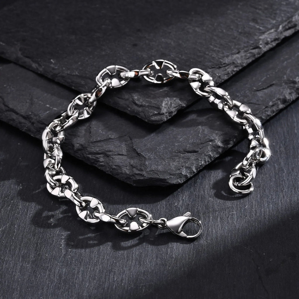 Handmade thick stainless steel chain bracelet with geometric links and a clasp, shown in a steel colour.