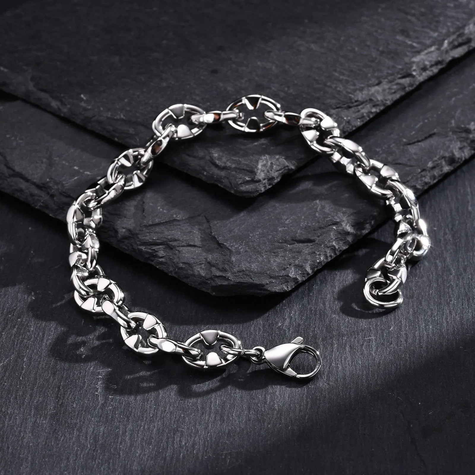 Handmade thick stainless steel chain bracelet with geometric links and a clasp, shown in a steel colour.