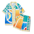 Plaid print beach outfit with short sleeve shirt and matching trousers on a mannequin