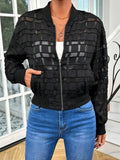 Black women's casual jacket with geometric pattern, full zip, and long sleeves on a hanger.