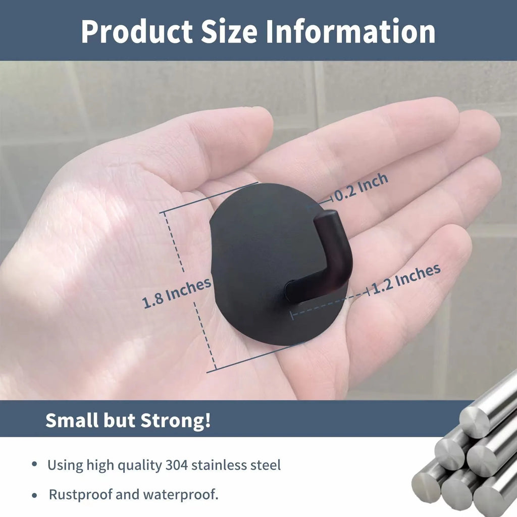 Two round stainless steel self-adhesive wall hooks, one black and one polished, on a white background.