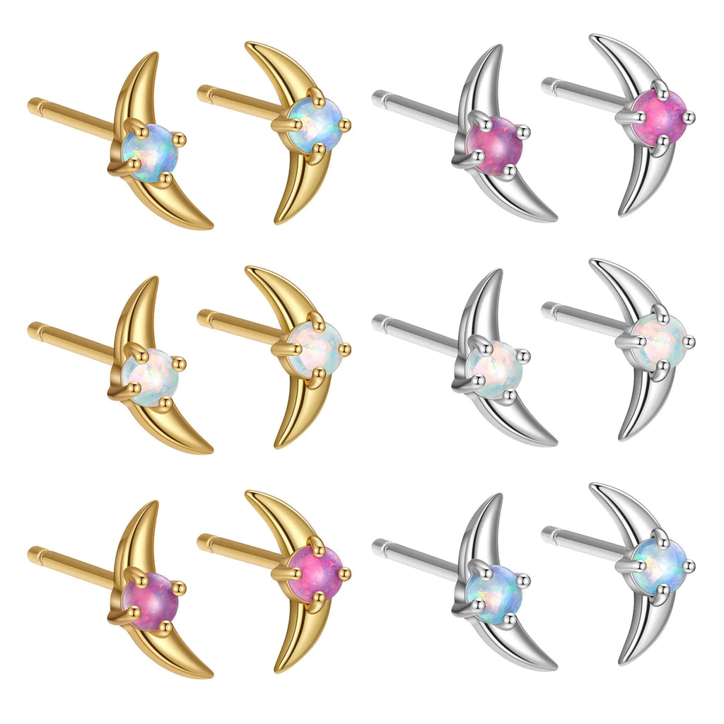 A pair of geometric-shaped sterling silver earrings with a gold-plated finish and a central blue zirconia stone.