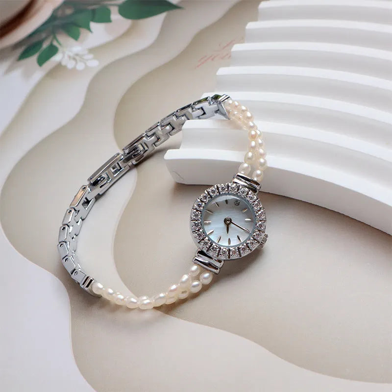 Women's light gold freshwater pearl bracelet watch with round 18mm dial