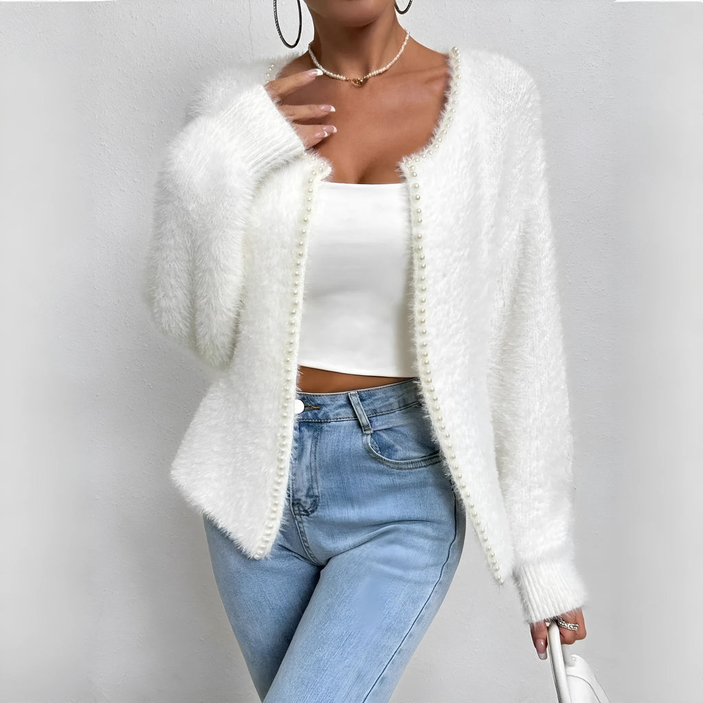 White women's V-neck cardigan sweater with medium thickness polyester construction