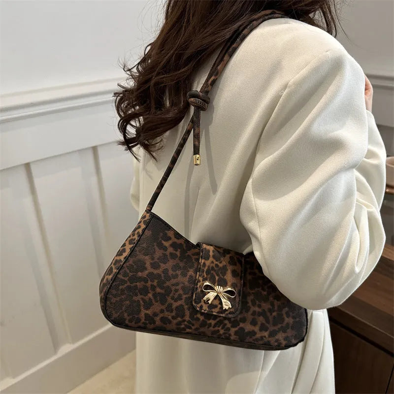 Large casual women's PU leather handbag with outer sandwich pockets in black, brown, coffee, or khaki.