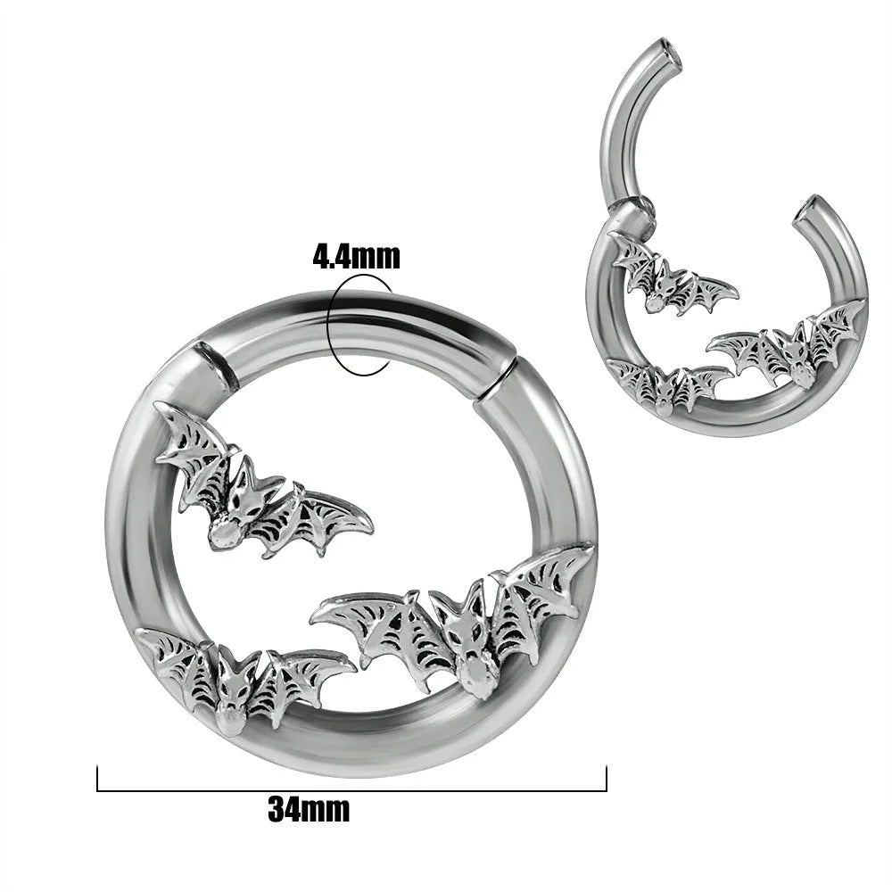 A pair of silver fashion earrings with a raised totem pattern, shown in one of 15 available electroplated colour finishes.