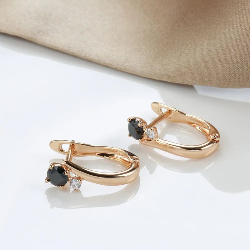 Gold geometric drop earrings with black agate stone accents and retro design