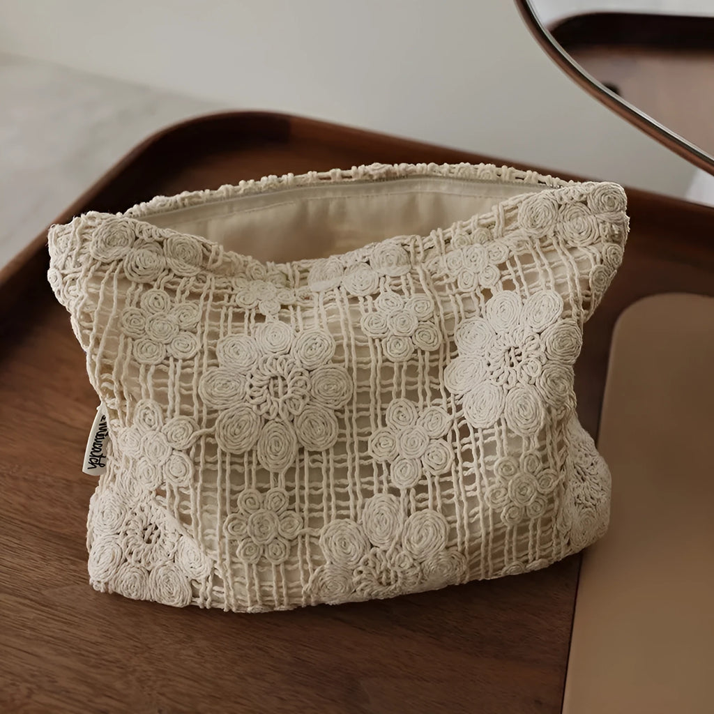 Handmade corduroy cosmetic bag with crocheted hollow flower pattern and ethnic embroidery