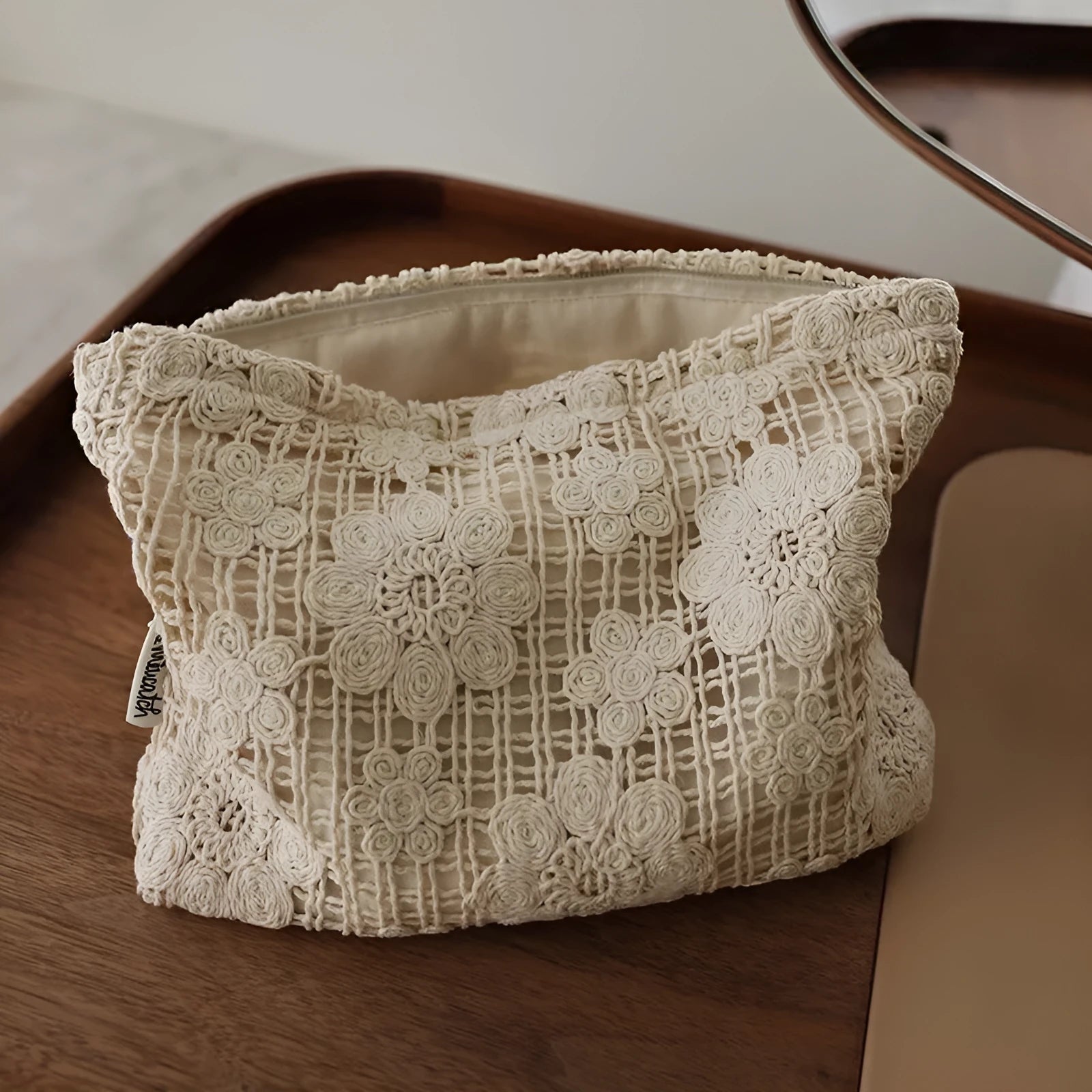 Handmade corduroy cosmetic bag with crocheted hollow flower pattern and ethnic embroidery
