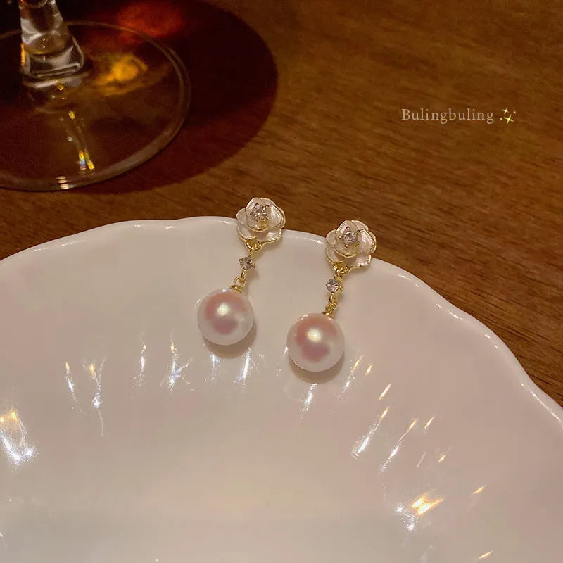 Camellia pearl flower stud earrings with alloy floral design for women