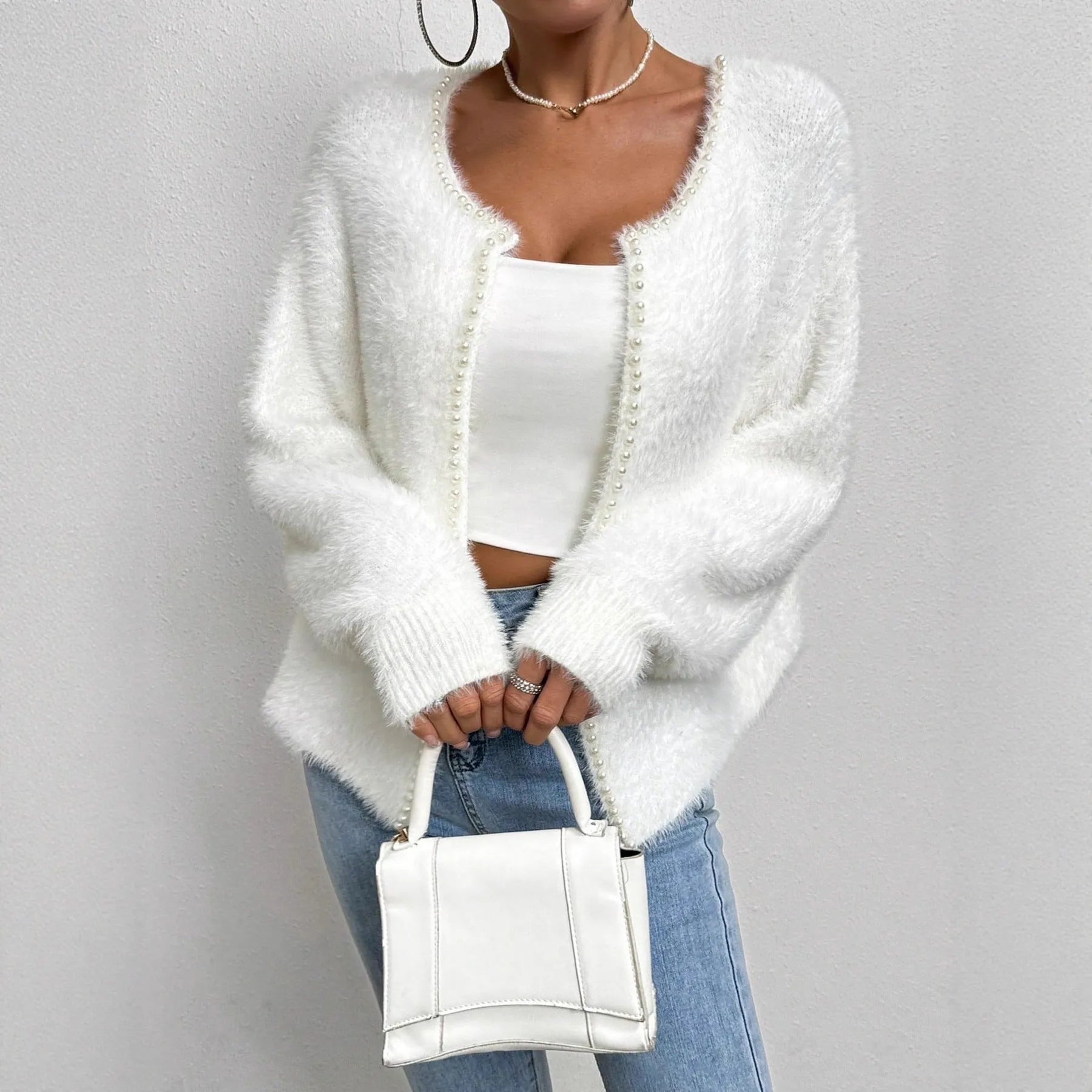White women's V-neck cardigan sweater with medium thickness polyester construction