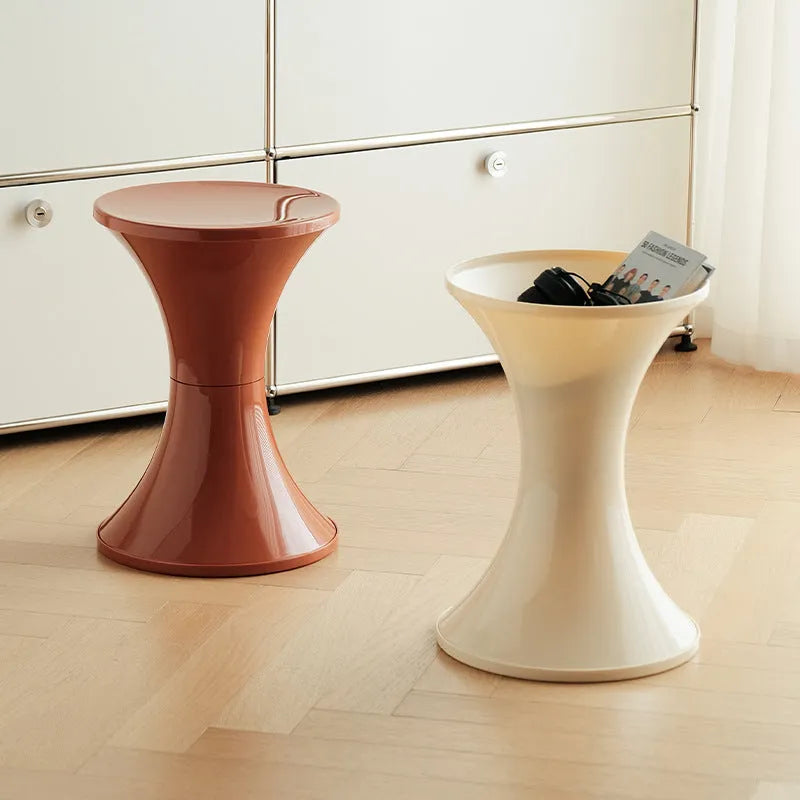 Hourglass-shaped plastic shoe changing stool in green, shown as a step aid.