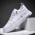 Men's white and black skateboard shoes with elastic band closure and rubber sole