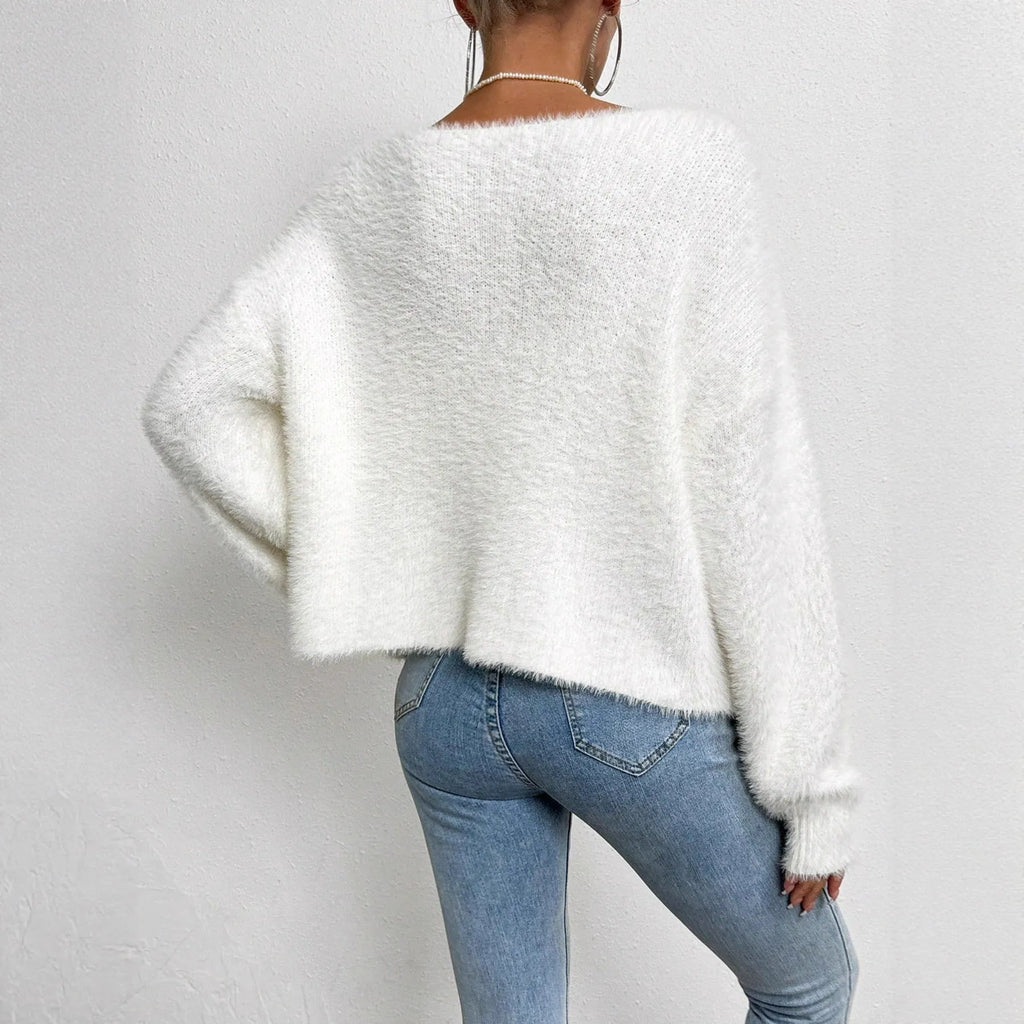White women's V-neck cardigan sweater with medium thickness polyester construction