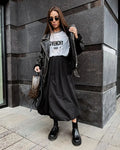 Women's solid colour long cotton skirt in black or white for casual commuting wear