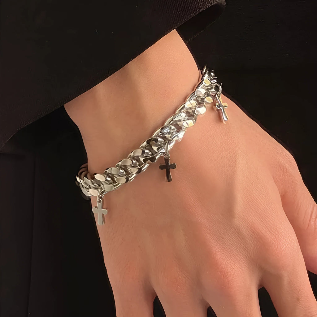 Men's titanium steel bracelet with a geometric shape and cross design on a wrist.