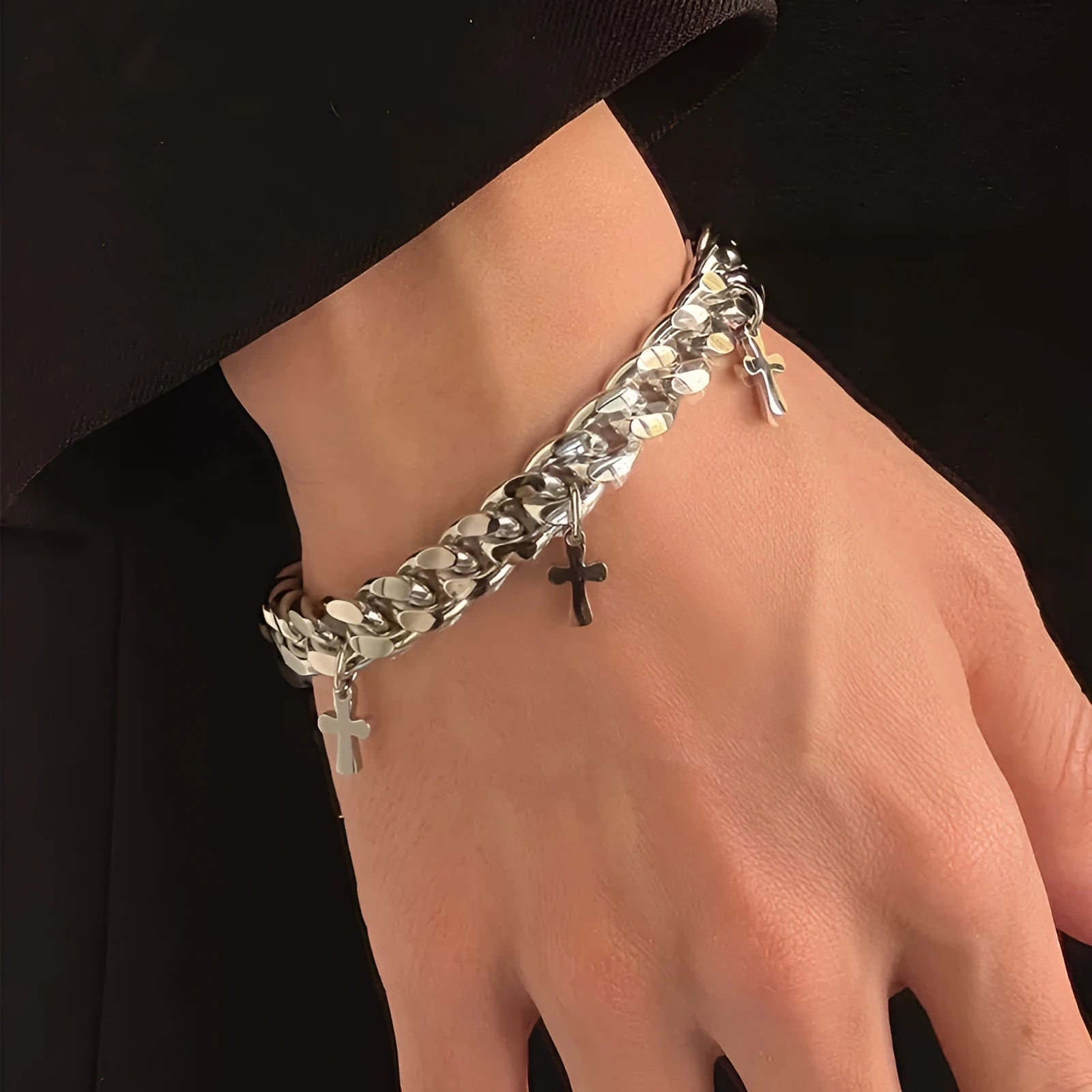 Men's titanium steel bracelet with a geometric shape and cross design on a wrist.