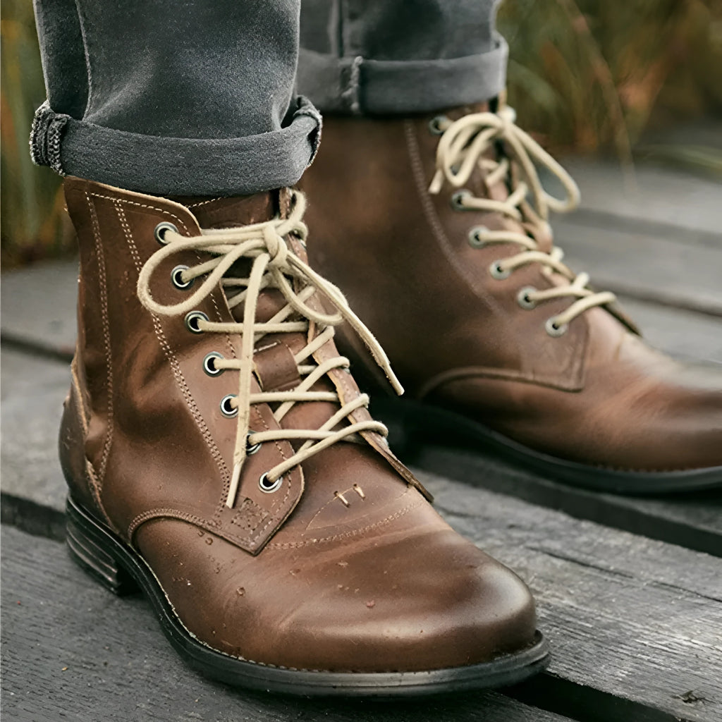 Men's black Knight Series leather ankle boots with a side zipper and low heel.