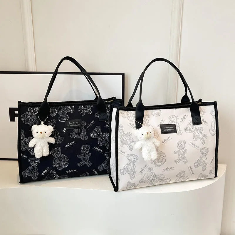 Printed canvas tote bag with rhombus pattern and sandwich pocket design in black colour