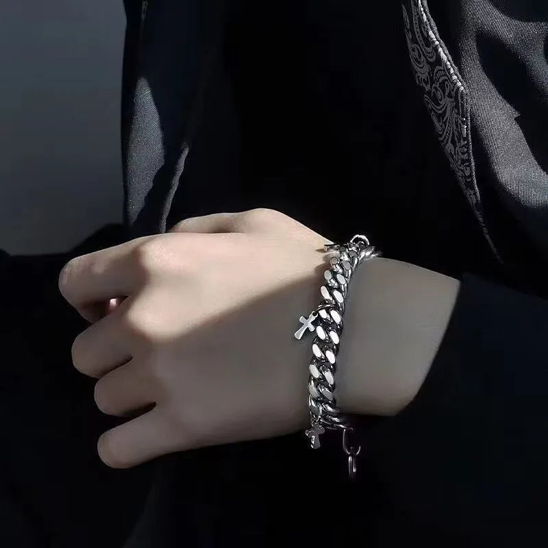Men's titanium steel bracelet with a geometric shape and cross design on a wrist.