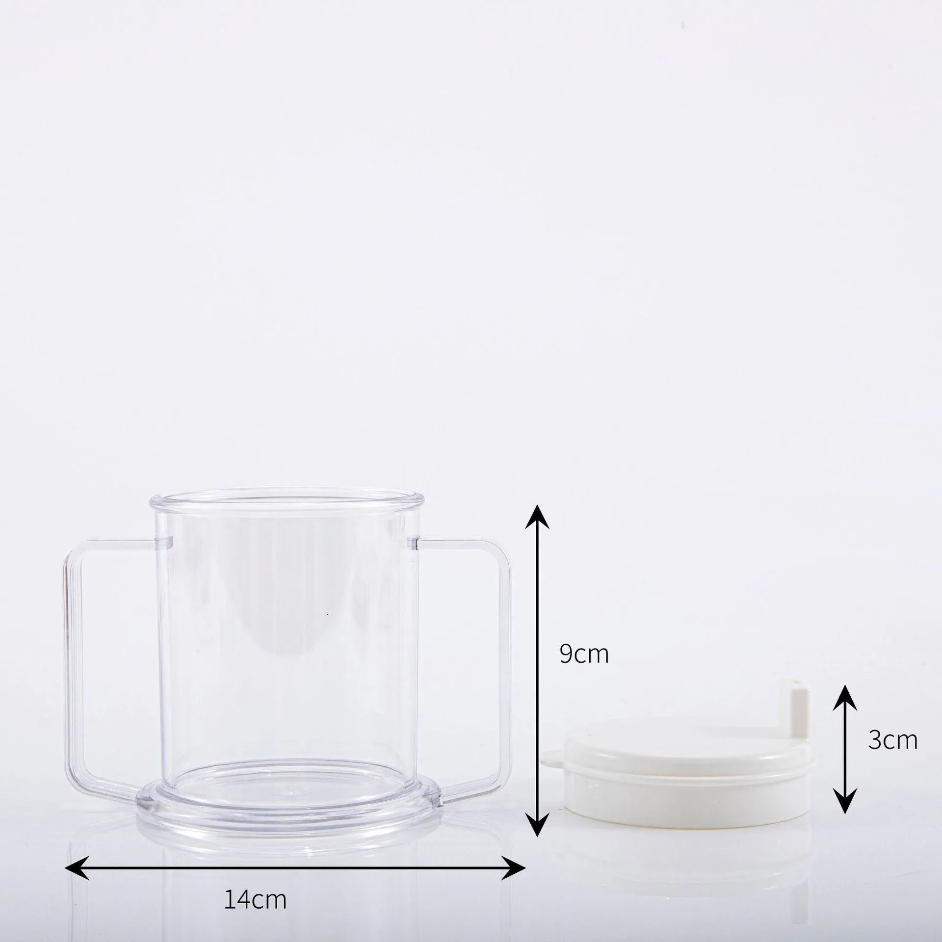 Transparent plastic spill-proof drinking cup on a table.