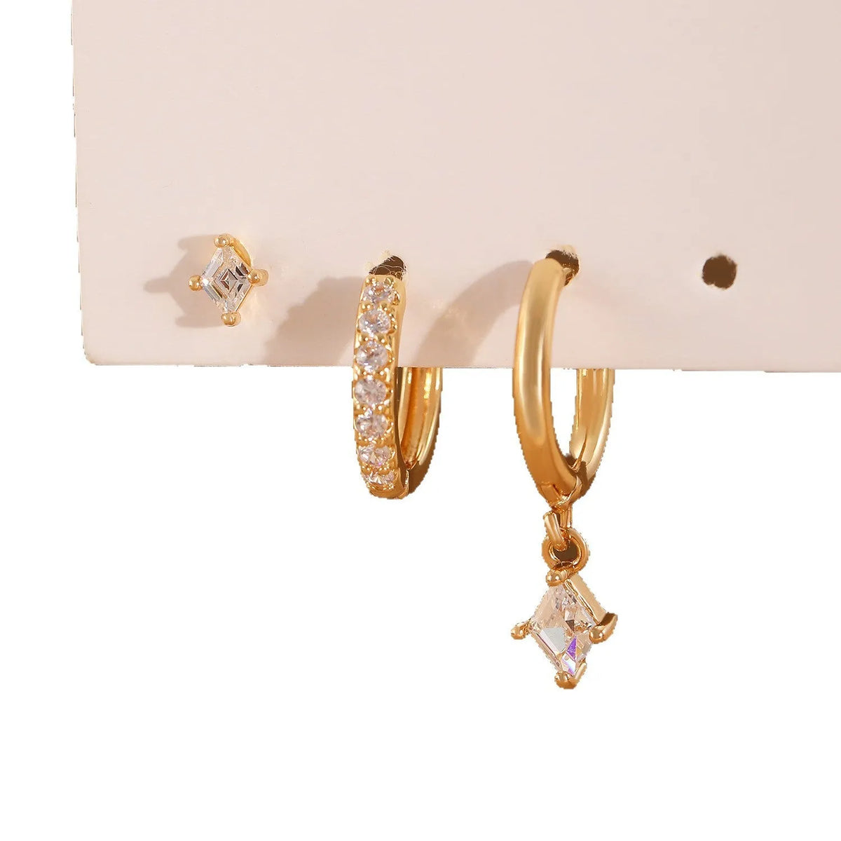 Ladies copper jewellery set with three geometric zircon pieces in gold or white