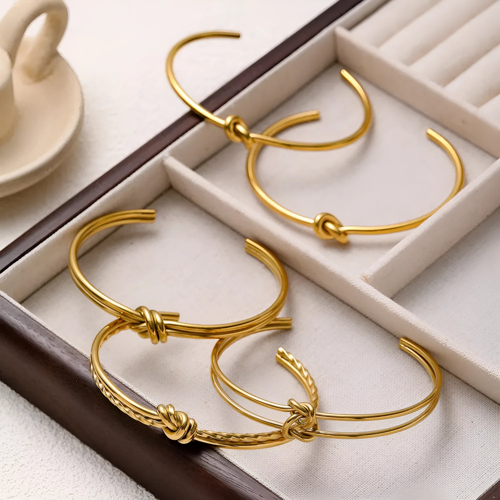 Women's adjustable C-shaped open bracelet with double-layer knotted design in gold or silver finish