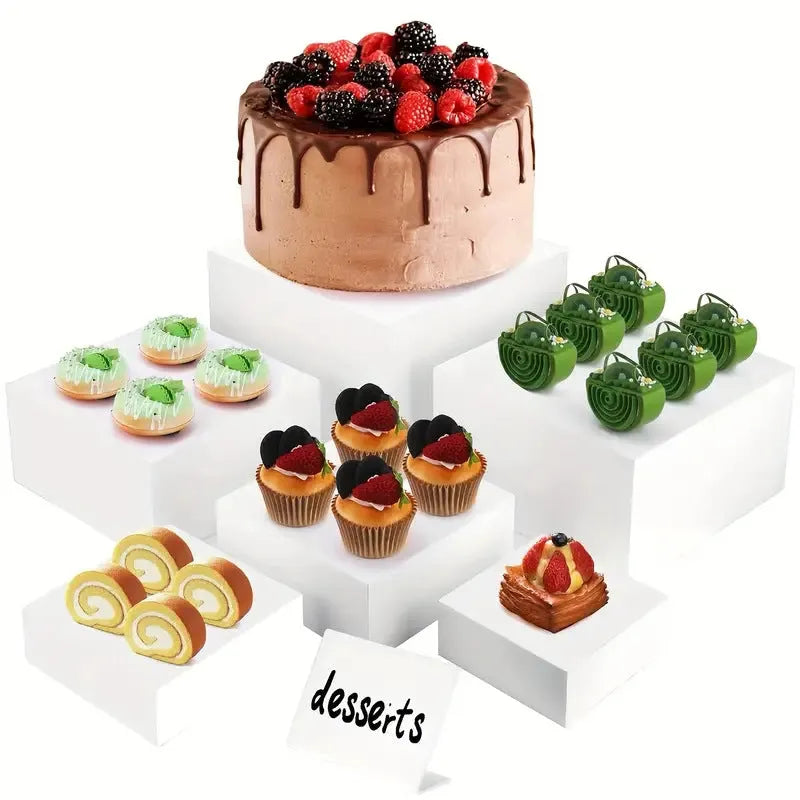 White plastic dessert display stand with six stacking cubes for tiered cake and dessert presentation