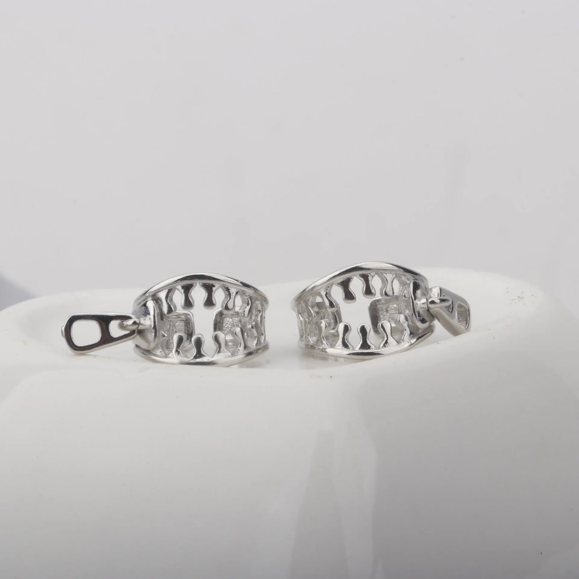 Copper geometric ear clip with zipper design detail and simple line elements