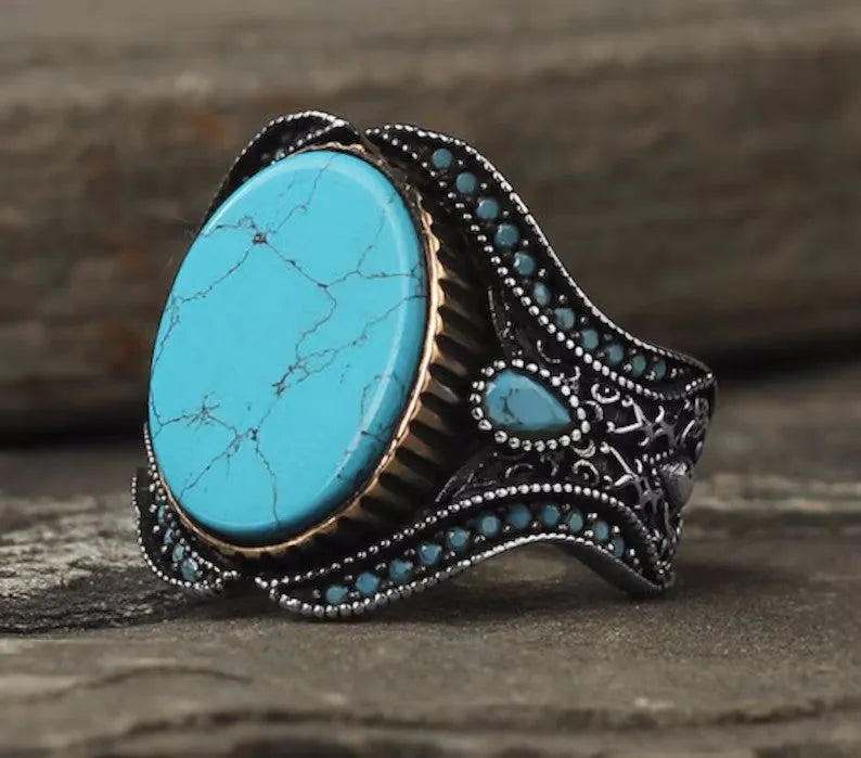 Men's antique silver turquoise alloy ring showing round simple design on finger
