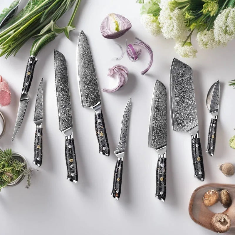 Damascus steel kitchen knife set showing eight knives with fishbone pattern blades, including chef, boning, and fruit knives.
