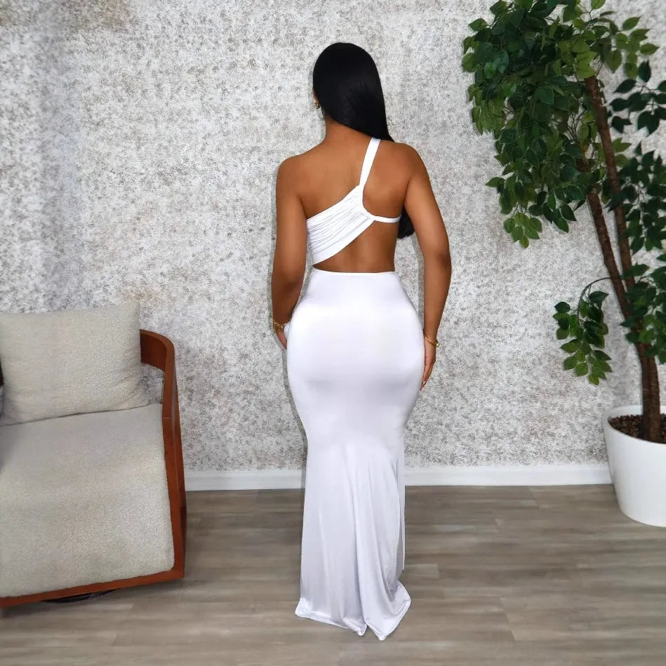 Women's solid colour long dress with one shoulder strap and pleated skirt in white, orange, or green.