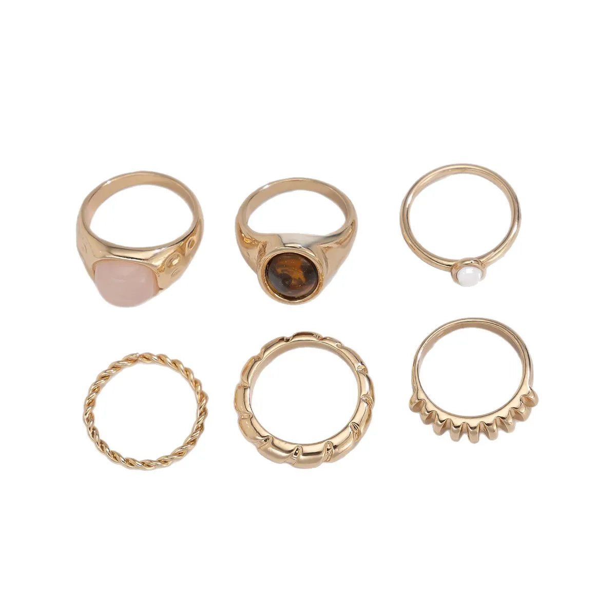 Six geometric alloy rings with light gold electroplated finish arranged in set